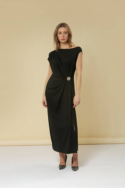 istock Female model studio portrait wearing black maxi dress with  beautifully draped front for a touch of sophistication and flow— elegant minimalist fashion collection 2245111928