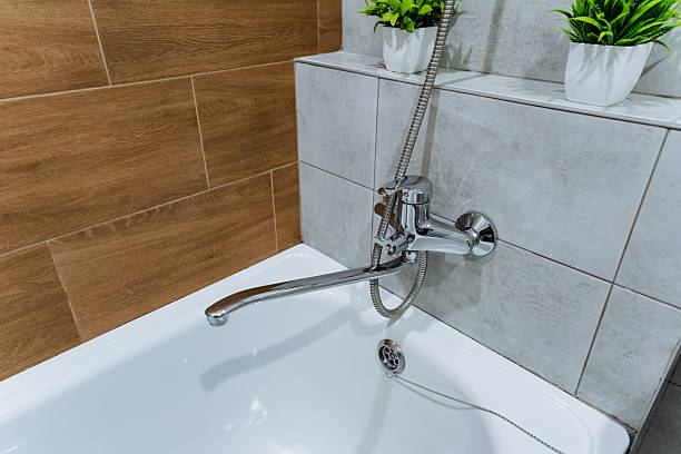 istock This generously spacious bathroom boasts a chic and stylish bathtub along with a contemporary modern shower head, providing excellent options for ultimate relaxation and cleanliness at home 2245114257