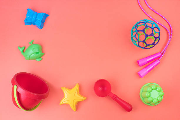 Colourful plastic buckets and spades essential beach tools for children for sale in outdoor shop.
