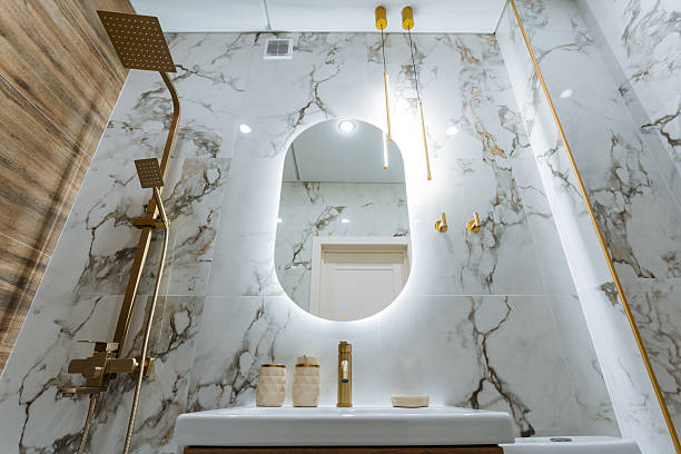 istock The bathroom features essential elements including a stylish sink, a wellplaced mirror, and an overhead shower head, creating a functional yet aesthetically pleasing space 2245115842