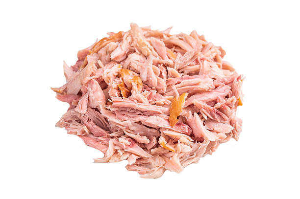 istock Heap of Pulled Chicken meat, hot smoked poultry isolated on white background 2245116582