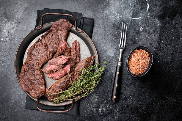istock Grilled Beef Machete Skirt Steak, prime meat. black background. top view 2245117905