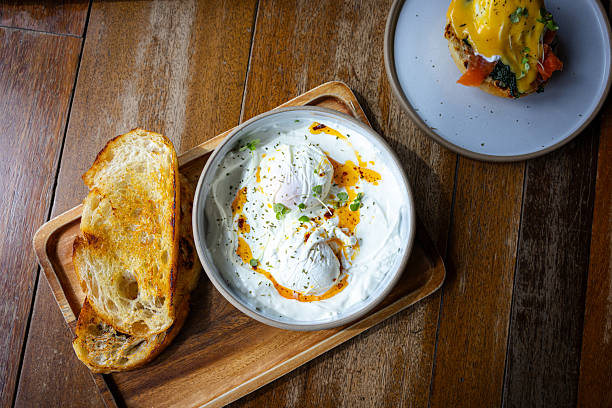 istock Poached egg serving with garlic yogurt and toast. 2245117998