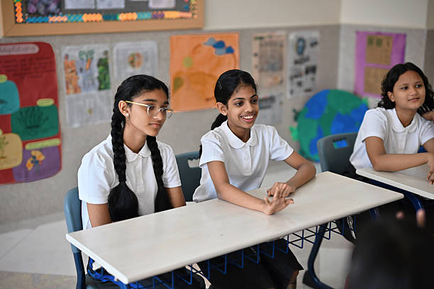 istock Attentive schoolgirls in classroom activity 2245123056