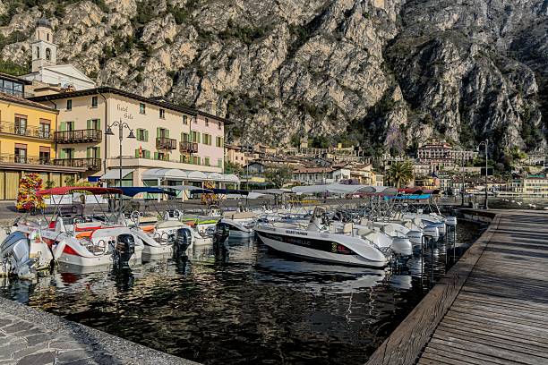 Limone sul Garda, Italy – April 11, 2025: Scenic view of Limone sul Garda's old town with boats on the water