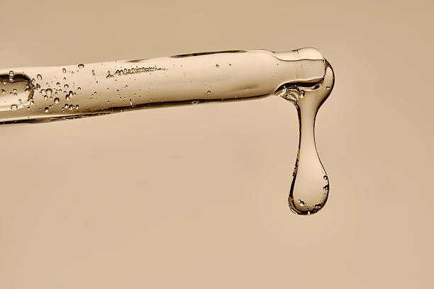 istock Serum in a pipette close-up on a beige background. 2245125713