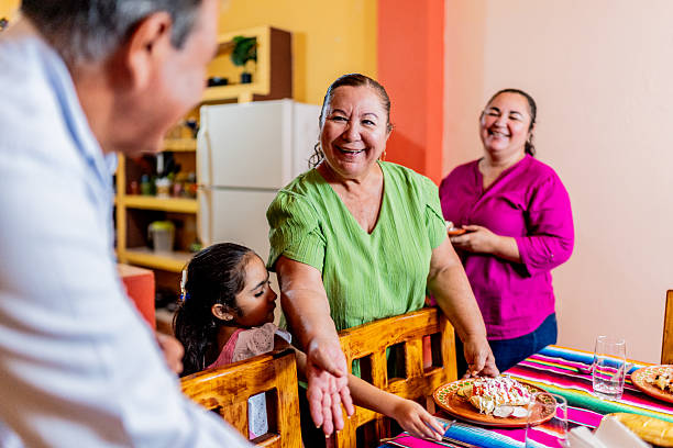 istock Family setting the table at home 2245126087