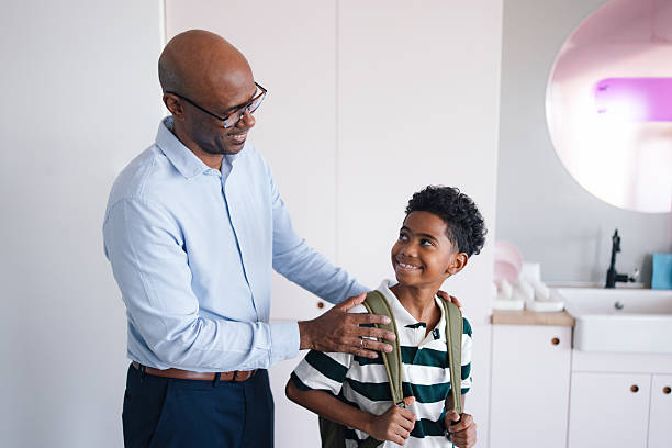 istock Father And Son Share Warm Moment At Home, Bonding And Preparing For School 2245126417