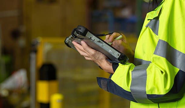 istock Close up of  Professional Female Technical Robotics Engineer Male using digital tablet, control system checking and inspection for repair maintenance robot arm manchine working in industrial factory. 2245126913