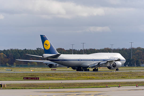 Lufthansa airplane type Boeing 747-830 registration D-ABYT retro livery taking off from Frankfurt Airport on an autumn day. Photo taken November 3rd, 2025, Frankfurt am Main, Germany.