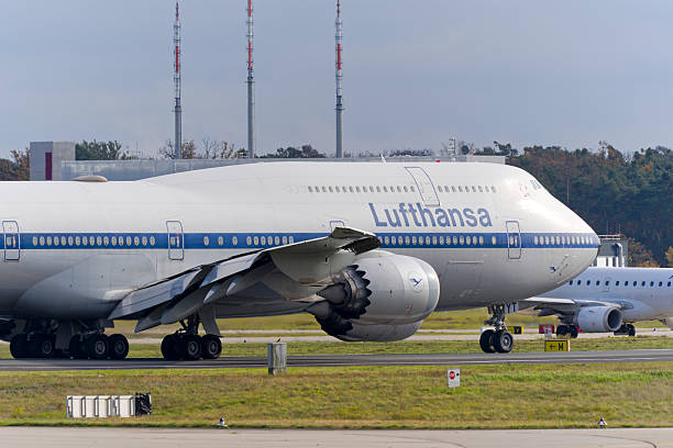 Lufthansa airplane type Boeing 747-830 registration D-ABYT retro livery taking off from Frankfurt Airport on an autumn day. Photo taken November 3rd, 2025, Frankfurt am Main, Germany.