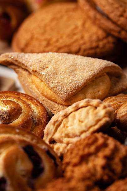 istock Assorted baked goods displayed on a wooden table, showcasing various textures and shapes 2245127975
