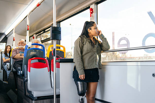 istock Young woman with prosthetic leg commuting on a public bus 2245129371