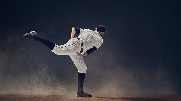 Baseball pitcher completing throw follow-through with dust swirling around showing momentum release. Concept of body in motion, biomechanics, and strength visuals for professional coaching design.