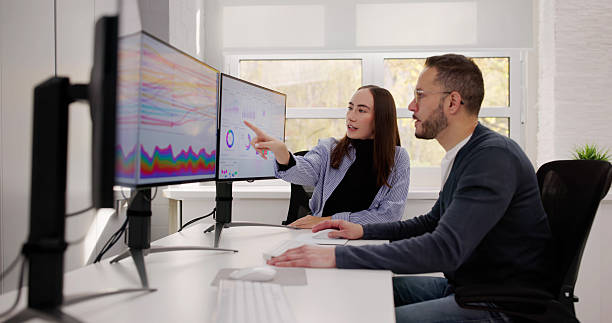 istock Team Of Analysts Reviewing Business Data 2245130497