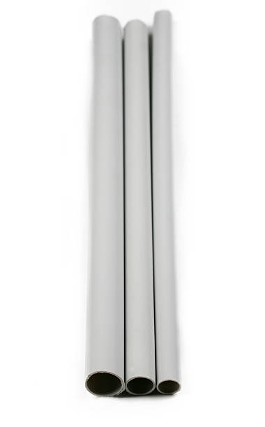 Gray colored flexible insulation tubing, industrial plastic construction material, cutout, isolated on white