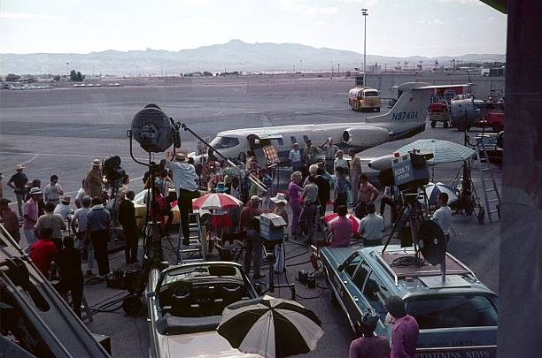 California (exact location unknown), USA, 1970. Break during filming at an airfield in California. Furthermore: film crew and equipment.