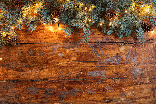 istock Christmas garland on a rustic wooden backdrop 2245133573