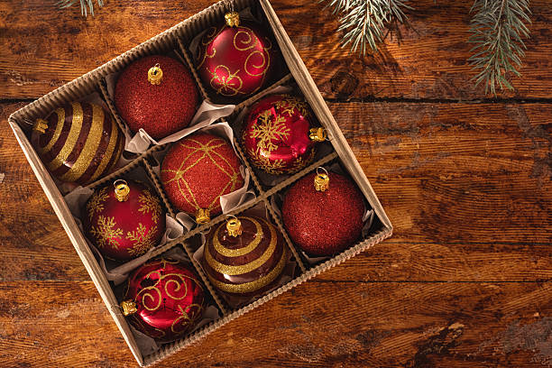 istock Christmas red ornaments on the wooden background 2245133629