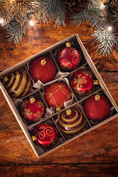 istock Christmas red ornaments on the wooden background 2245133635