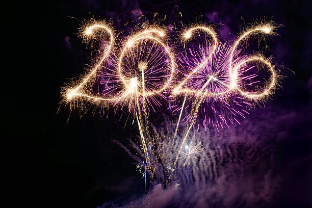 istock Sparkler Happy New Year 2026 with fireworks 2245133685