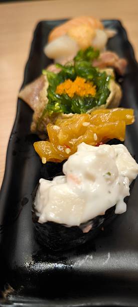 Sushi on a black plate Japanese food