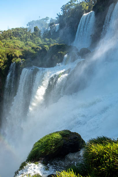 Iguacu Falls in Brazil in the foreground and Argentina seen beyond the river