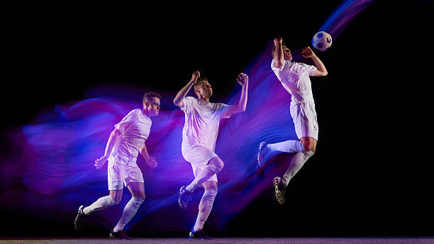 istock Sequence of soccer player jumping for header with glowing neon light motion 2245142219