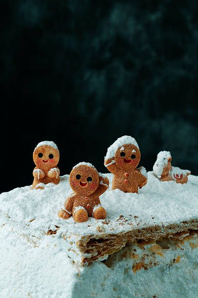 istock group of gingerbread men in snow 2245143485