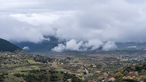istock Dramatic Mountain Landscape with Road and Cloud-Kissed Peaks 2245144085