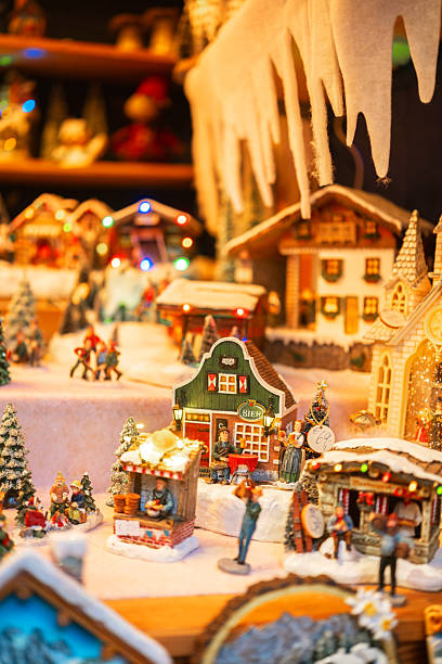 istock Miniature winter village scene with glowing lights and icicles 2245148961