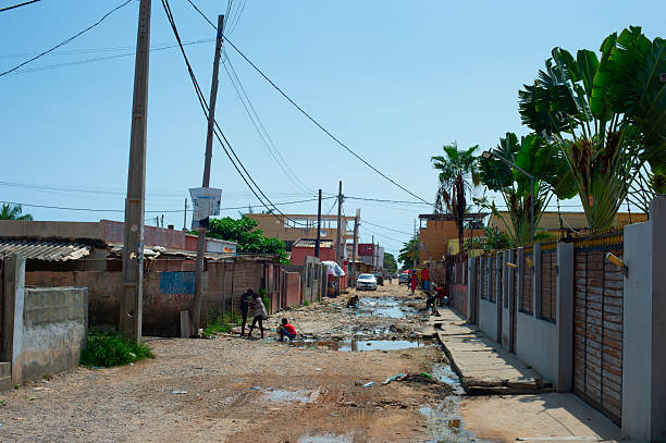 African man sitting in his house yard view from above Senegal