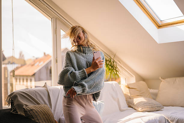 istock Woman enjoying music and sunlight 2245150289