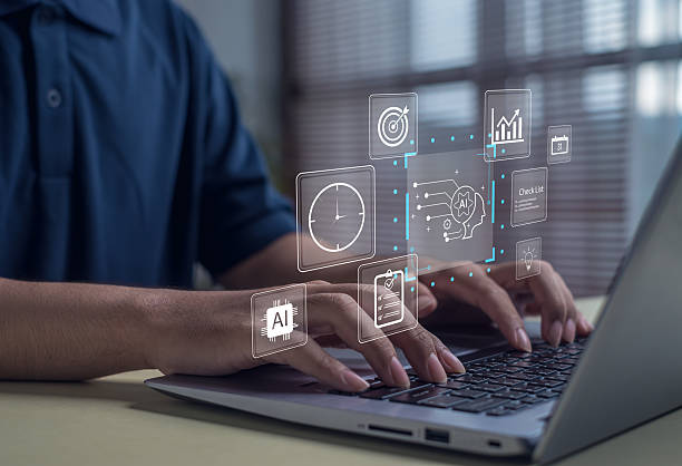 istock Man using laptop with artificial intelligence and digital data icons. Concept of AI technology, automation, innovation, and smart solutions for modern business productivity and data management. 2245154430