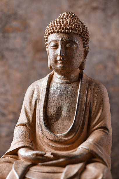 istock Meditating Buddha Statue on dark background. Soft focus. Close up. Copy space. 2245163543