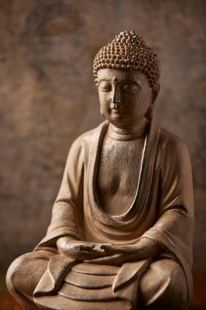 istock Meditating Buddha Statue on dark background. Soft focus. Close up. Copy space. 2245163572