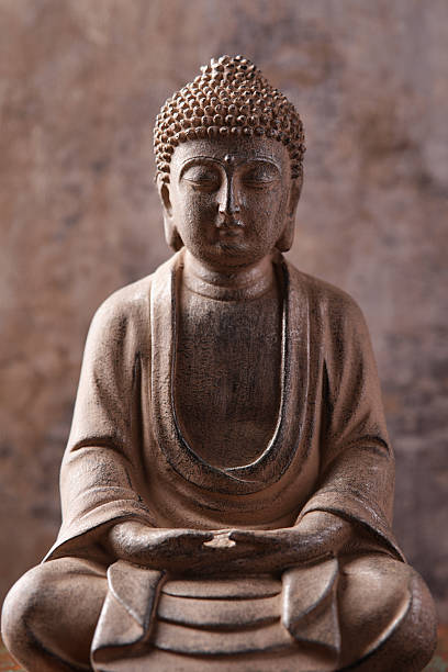 istock Meditating Buddha Statue on dark background. Soft focus. Close up. Copy space. 2245163597