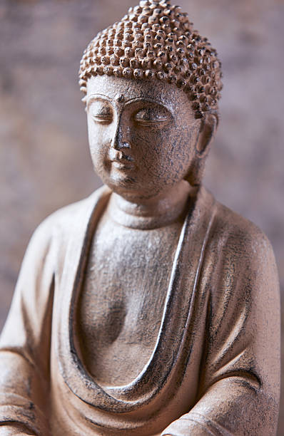 istock Meditating Buddha Statue on dark background. Soft focus. Close up. Copy space. 2245163664