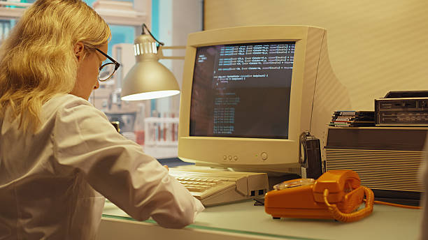 Retro medical research laboratory. Oscilloscope and other old technology being used to conduct research. Team of scientists working to collect data
