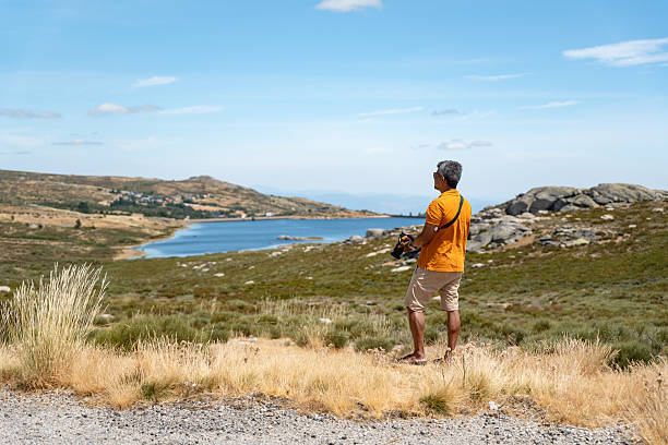 Tourist at the lake in the Serra da Estrela, Covilhã, Castelo Branco, Portugal