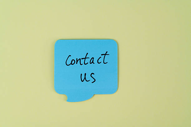 istock Blue adhesive note with text contact us on yellow background 2245172932