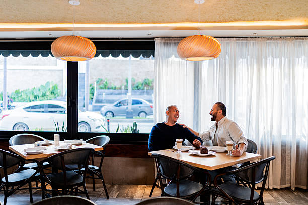Gay couple talking on coffee shop