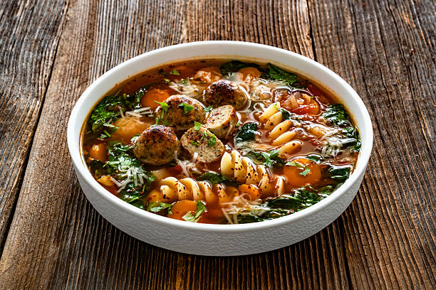 istock Italian Meatballs Wedding Soup on wooden table 2245181468