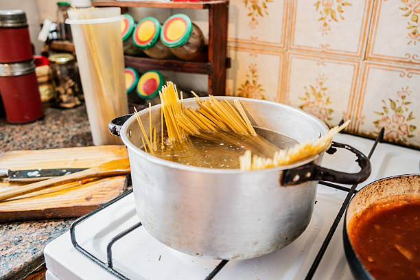 Close-up of spaghetti pasta cooking in boiling water