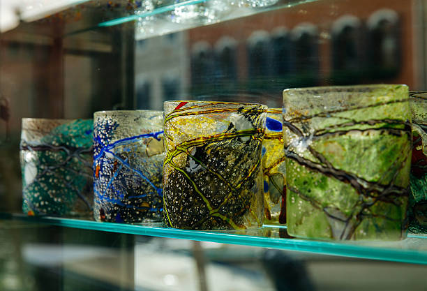 Colorful handcrafted glass tumblers on display in venetian shop