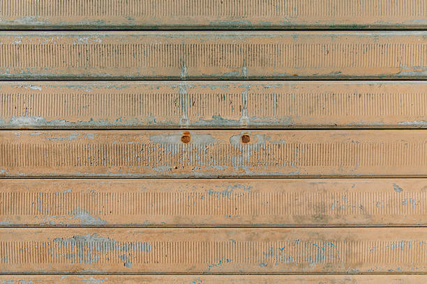 Rusty textured metal surface with peeling paint and corrosion