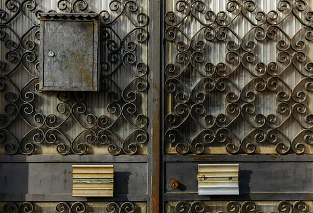 Ornate iron gate with mailbox