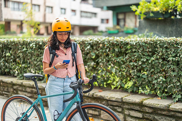 istock Young Asian woman delivery worker checking smartphone 2245188303
