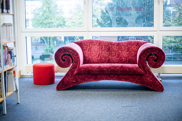 beautiful red sofa in a public library on a cloudy day