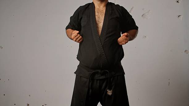 istock Martial Arts Practitioner in Traditional Black Gi Uniform 2245188885